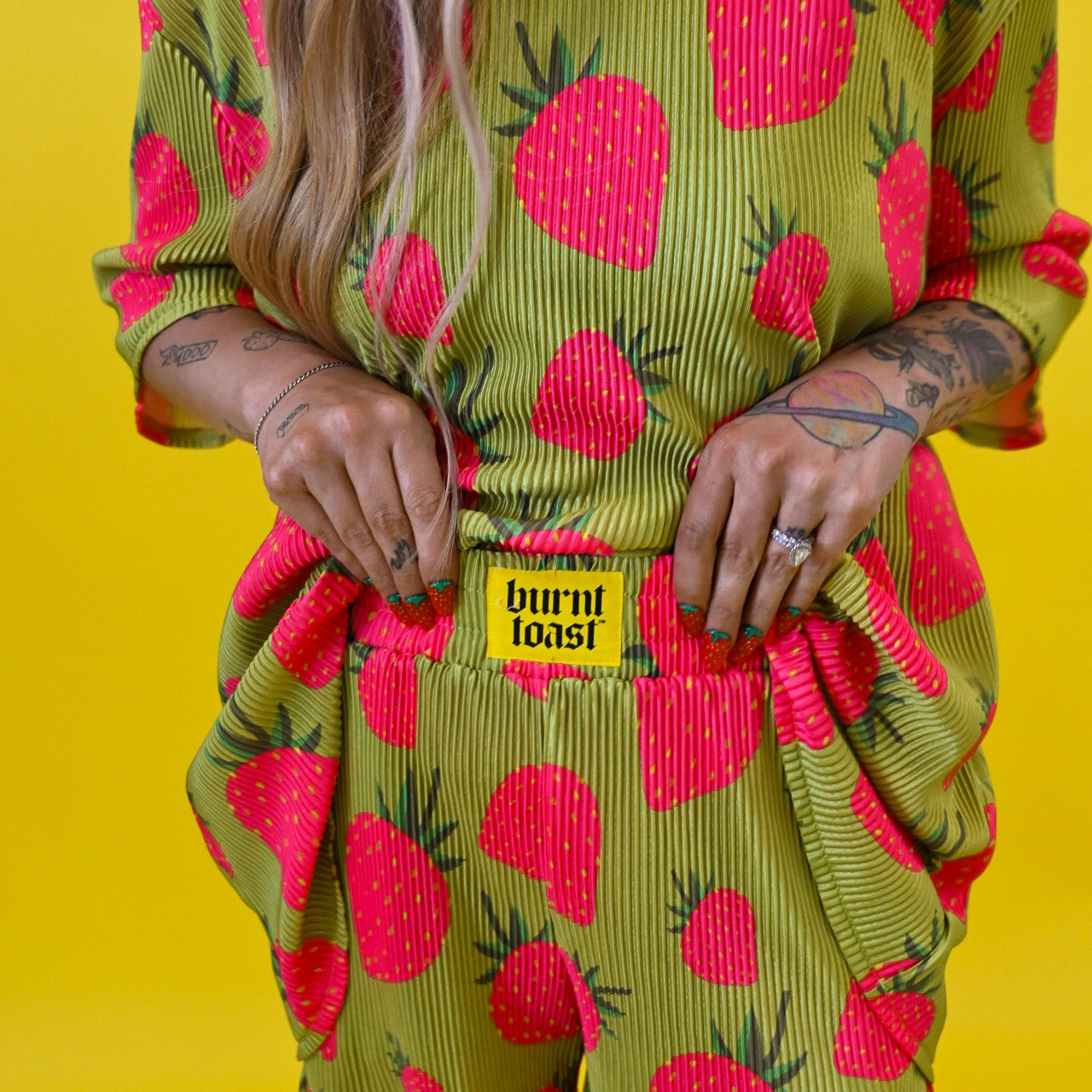 Burnt Toast plisse set that includes pants, shorts, and tops with long sleeves and short sleeves, with original in-house designs