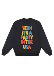 Black sweatshirt with colorful text 'Yeah It's a Party in the USA' on a white background, flat lay frontal view