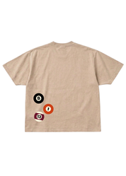 Beige graphic shirt with billiard ball designs on the back against a white background, flat lay back view
