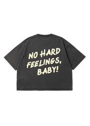 Black t-shirt with yellow text 'NO HARD FEELINGS, BABY!' on a white background, flat lay back view