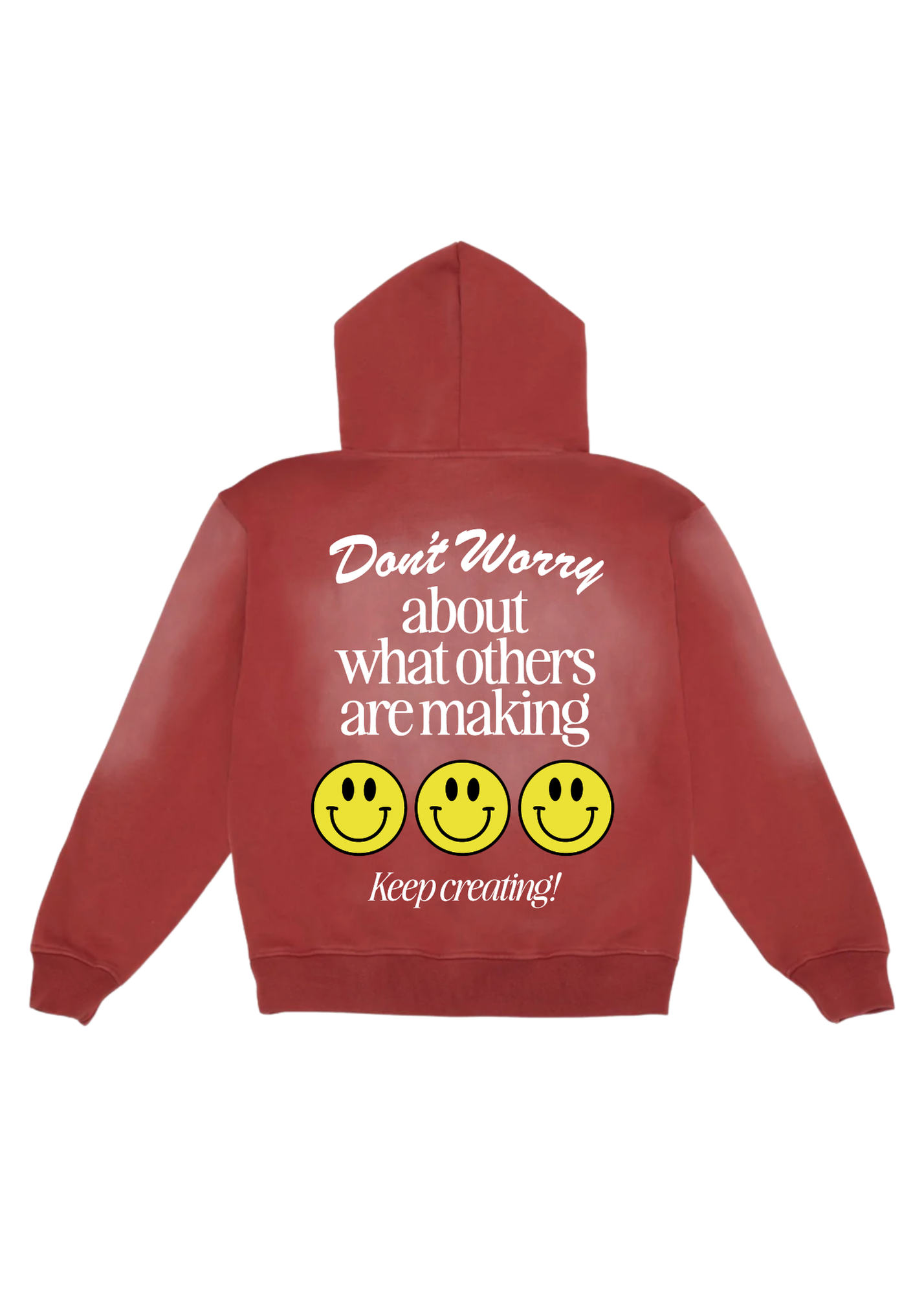 Red hoodie distressed with 'don't worry about what others are making keep creating!' text and 3 smiley faces flat lay on a white background, back view
