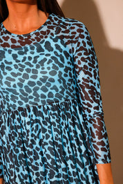 Brown and black leopard mesh fabric detail showing sheer texture and neckline