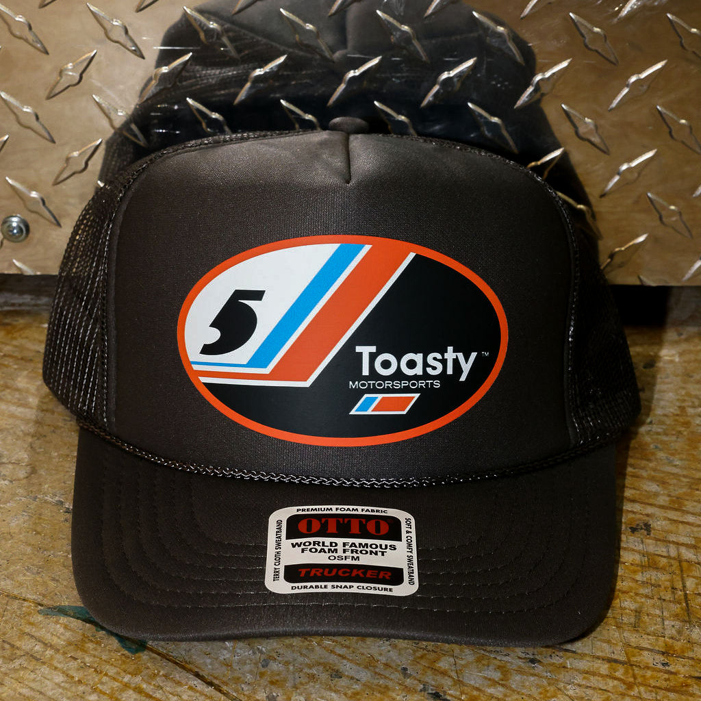 Grey trucker with a logo on a metallic surface, frontal view