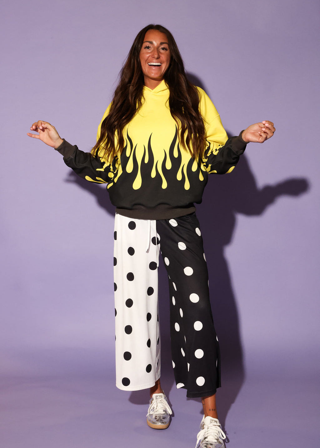 drip design, white and black polka dot wide-leg pants, and sneakers, frontal view