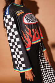 Black long-sleeve mesh jersey with 'Burntoast' logo and flames design, worn by a person, close up side view