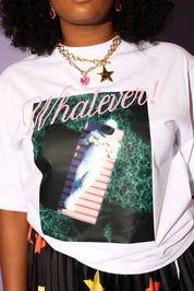 Person wearing a white sweatshirt with a graphic design and text 'Whatever!' on a dark background, close up view