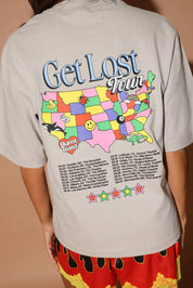 Model wearing a t-shirt with a colorful map of the United States and text on the back, close up back view