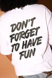 White t-shirt with 'Don't forget to have fun' text on the back