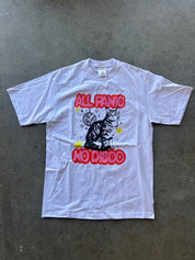 White graphic tee with All Panic, No Disco text and a cat on a concrete surface