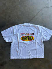 Burnt Toast logos on a white shirt on a concrete surface 