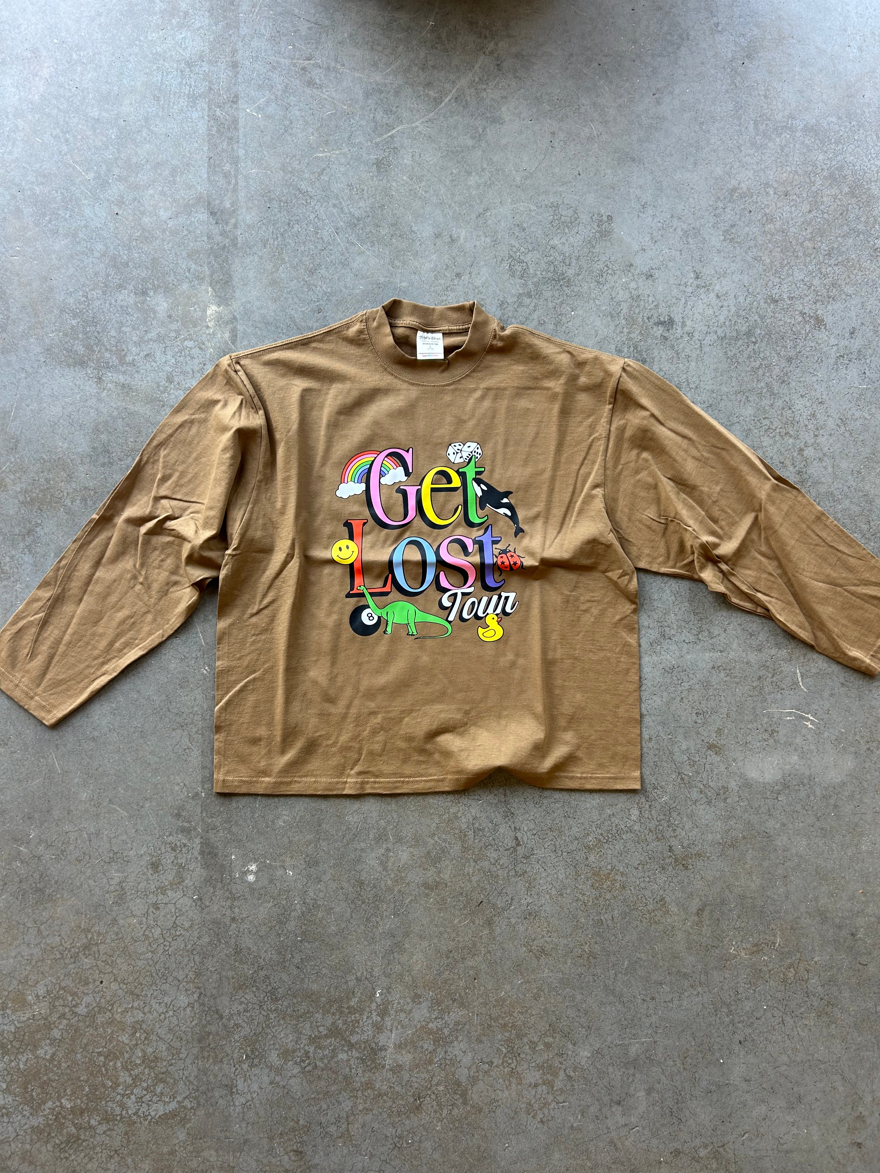 Long sleeve brown tee with Get Lost graphic on a concrete surface