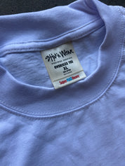Close-up of a light lavender oversized crewneck t-shirt showing the inner neck label which reads 'SHIKA WEAR' and 'OVERSIZE TEE XL'.