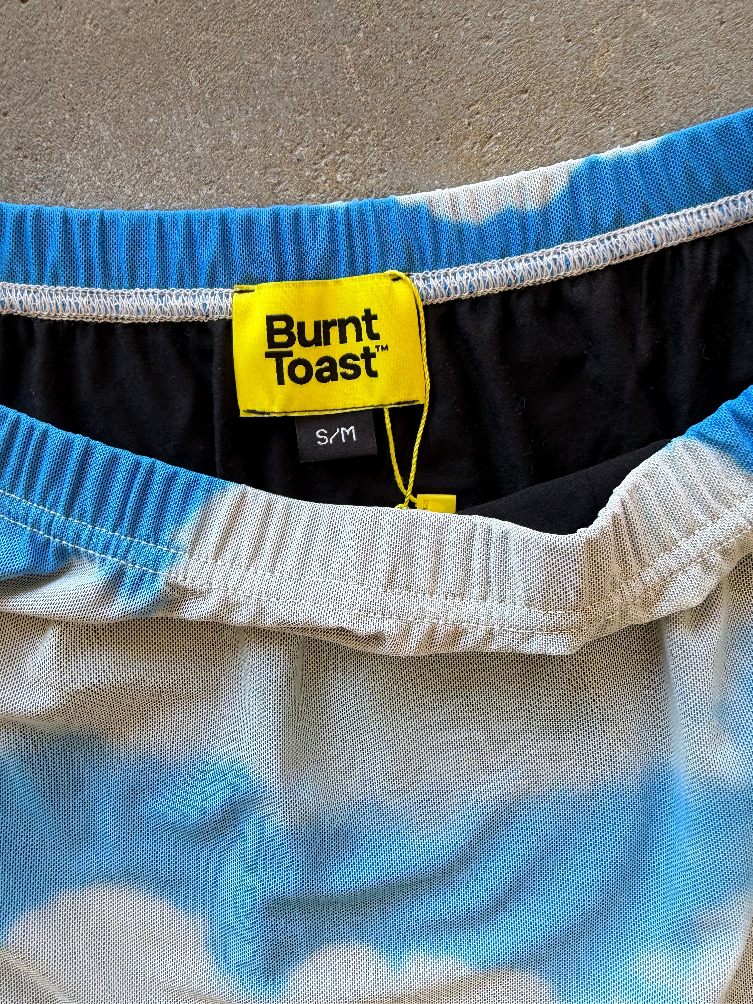 Close up of waistband featuring a s/m Burnt Toast tag