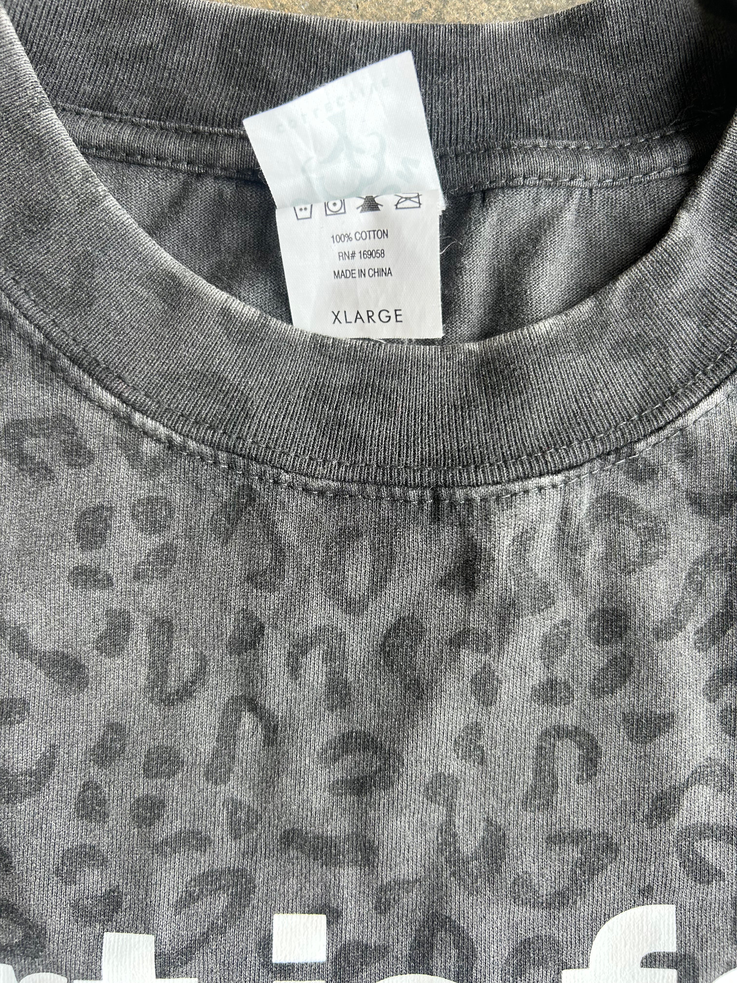 Close up of XL tag on collar of graphic tee