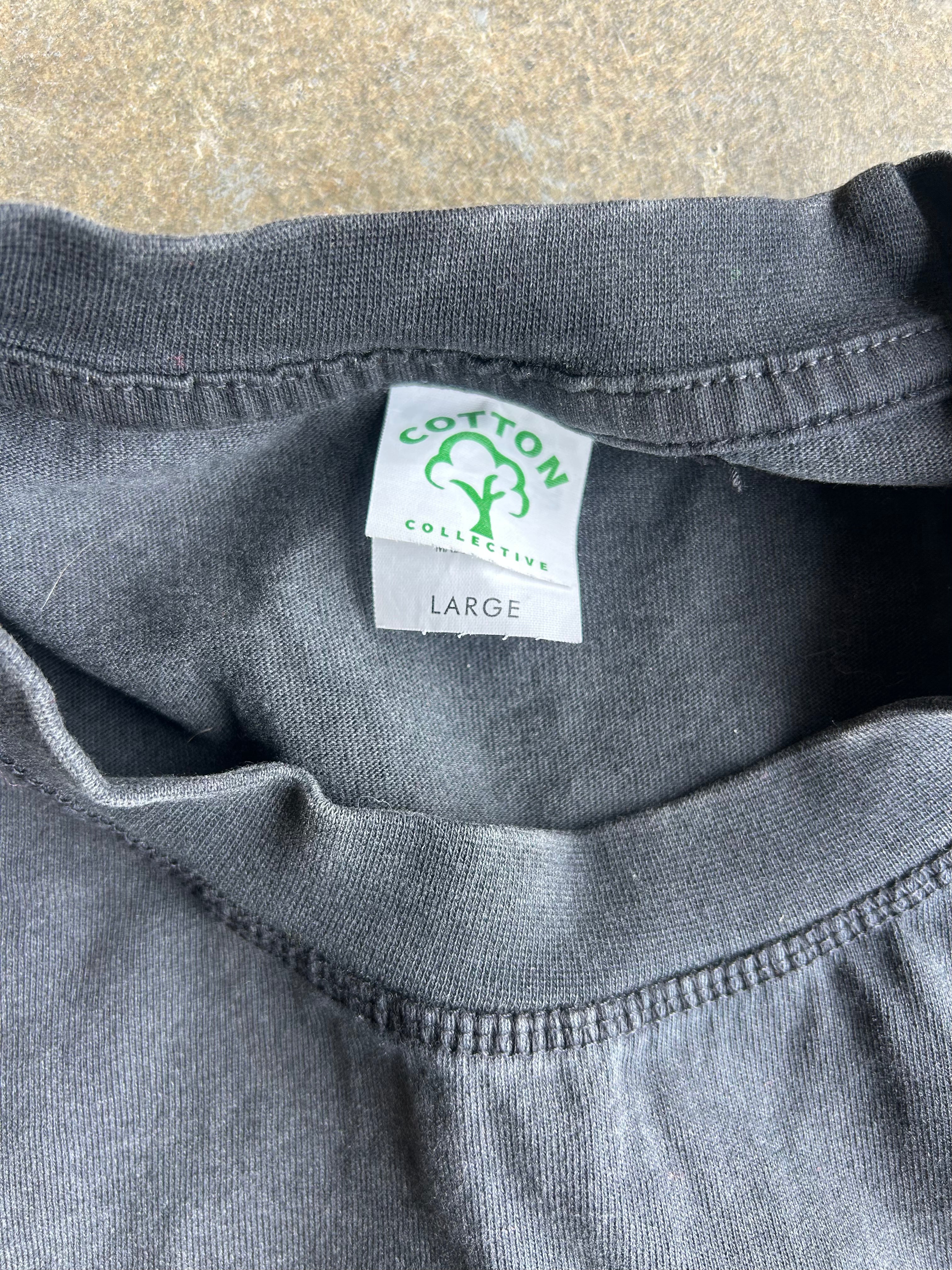 Close up of collar with a cotton collective tag and size Large text