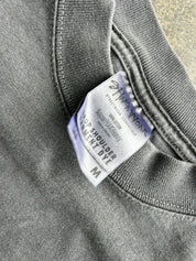 Close-up of a dark gray heather crewneck sweatshirt showing the inside neck label which reads 'Star Work' and 'PRO SHOULDER DYE'.