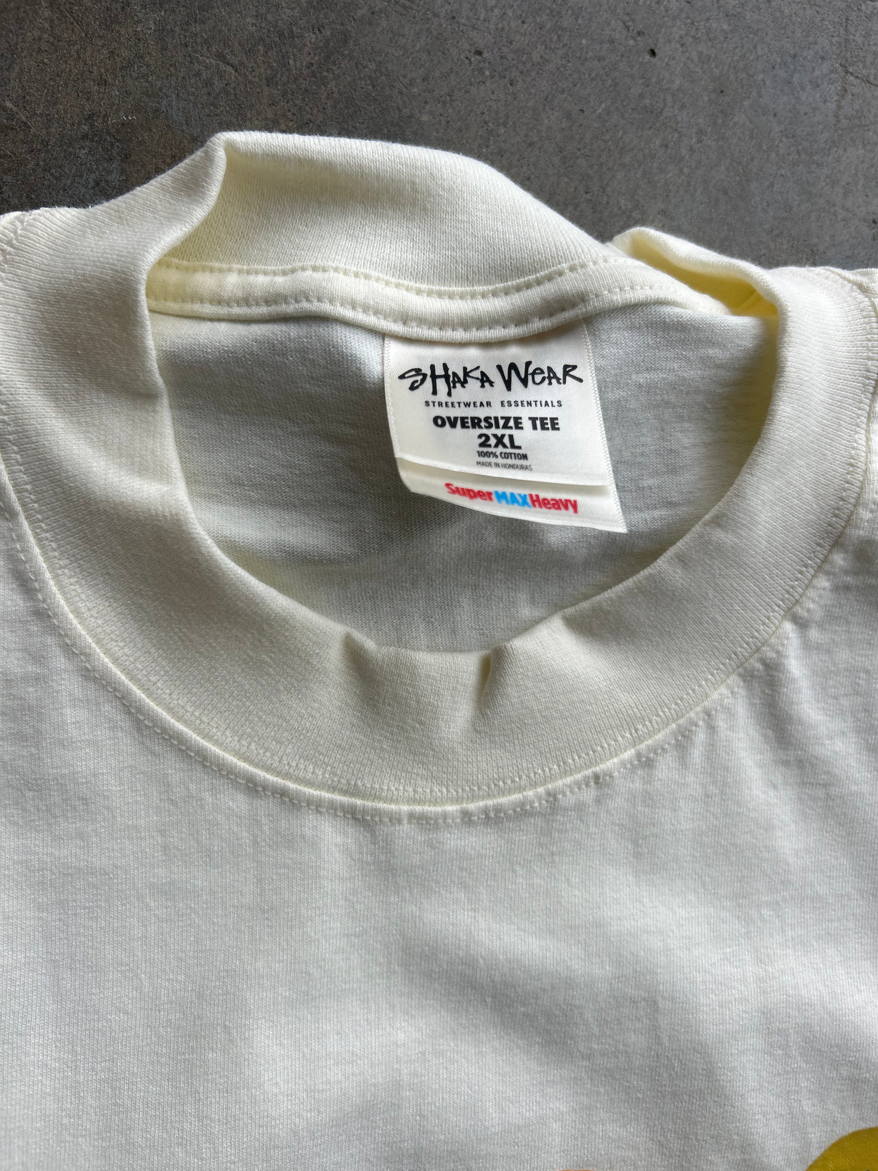 Close-up of the inside collar of an off-white oversized t-shirt, showing the brand label 'John Wick' and size '2XL'.