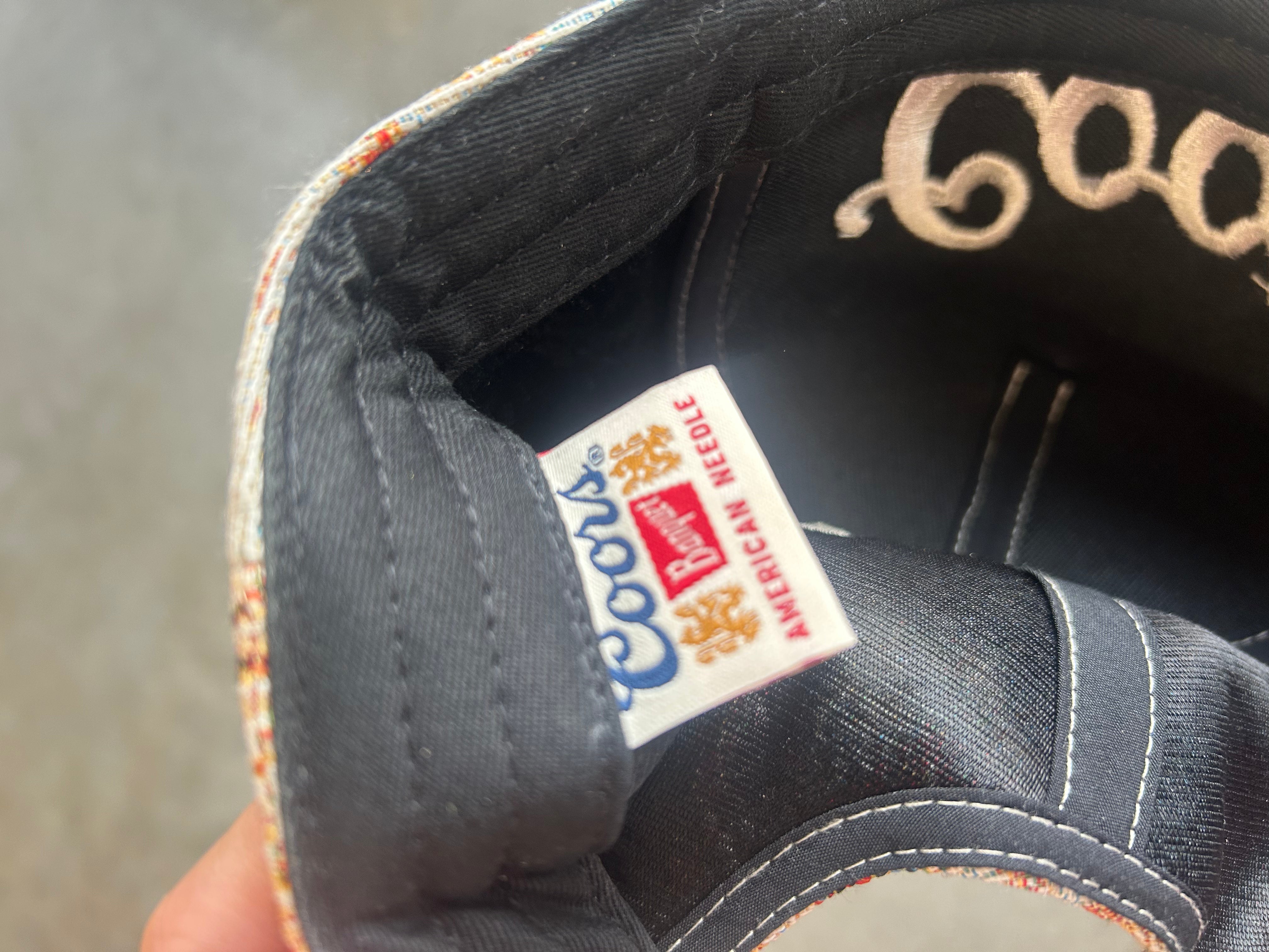Inside of a hat with a Coors Tag