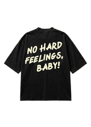 A black short-sleeve t-shirt with the phrase 'NO HARD FEELINGS, BABY!' printed in a bold, cream-colored retro font on the back, displayed against a solid white background