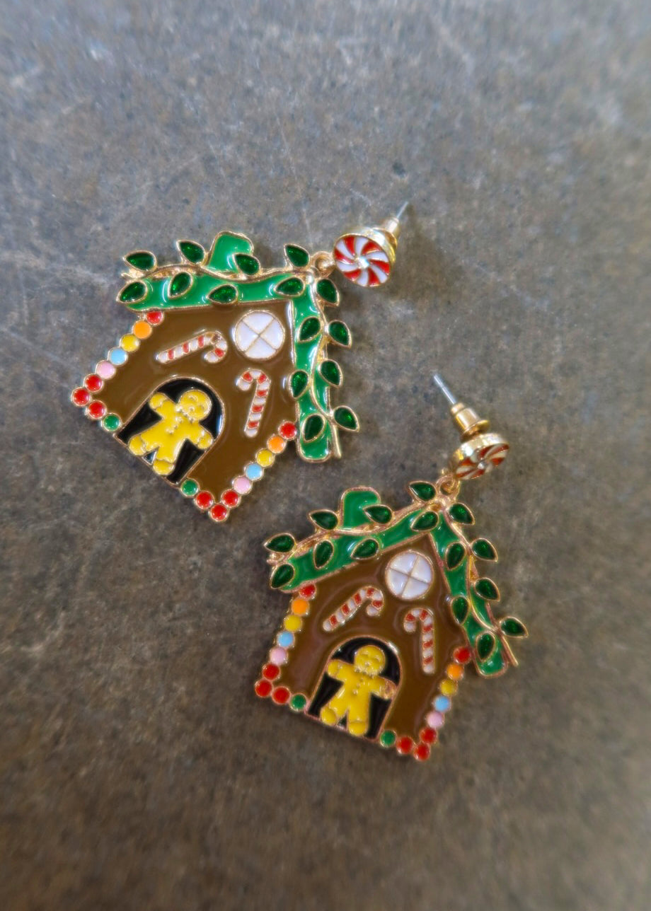 Pair of gingerbread earrings on a dark surface