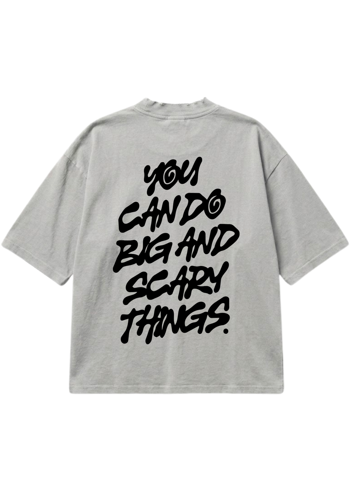 A light gray oversized short-sleeve t-shirt shown from the back, featuring the phrase 'YOU CAN DO BIG AND SCARY THINGS.' printed in a large black brush-stroke style font