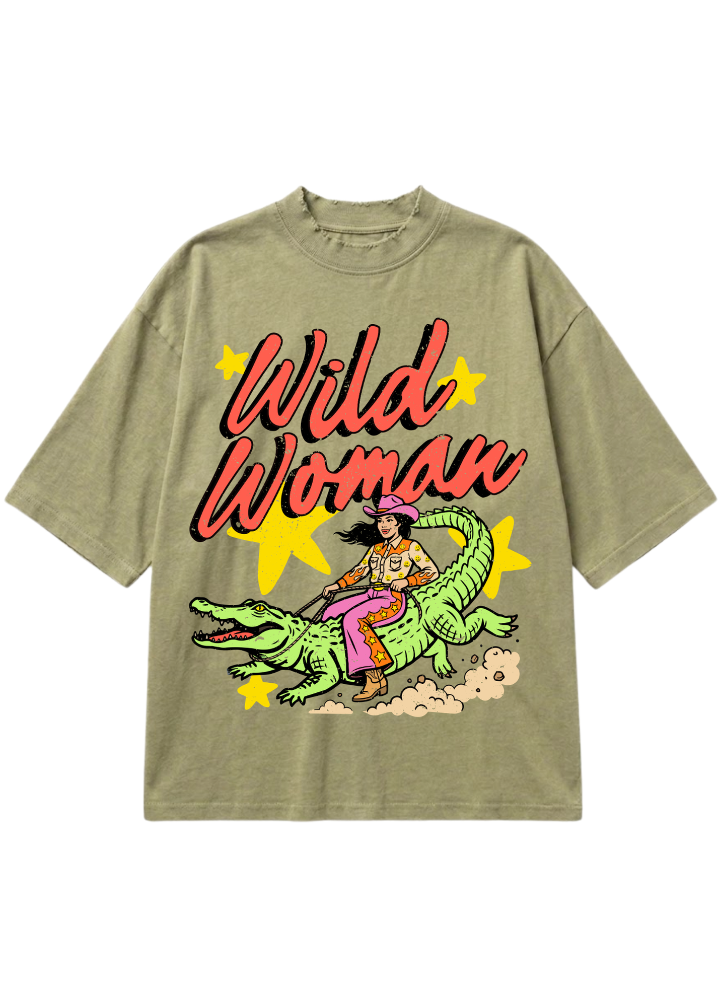 An oversized short-sleeve t-shirt in a washed olive green, featuring a retro graphic of a woman riding a green alligator with the text 'Wild Woman' in red script and yellow star accents