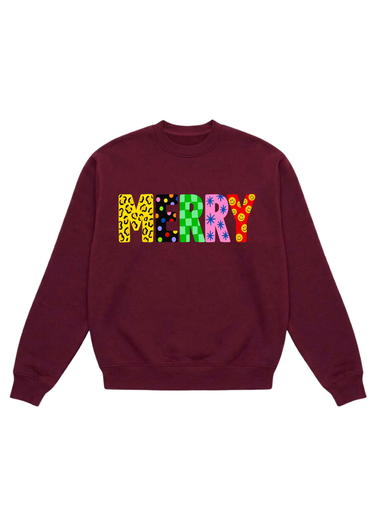 A burgundy oversized crewneck sweatshirt featuring “MERRY” in large bold block letters across the chest, each letter filled with a different colorful pattern — yellow leopard, multicolor polka dots, green checkerboard, blue stars, and pink with yellow smiley faces. Flat lay on white background.