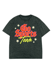A dark grey short-sleeve t-shirt with a subtle leopard print pattern, featuring a colorful graphic on the front that reads 'Go Sports Team' in red, yellow, and orange lettering with small gold stars