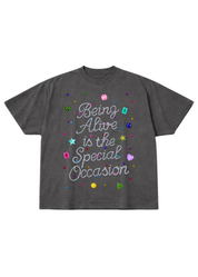Gray t-shirt with colorful text 'Being Alive is the Special Occasion' and graphics on a white background