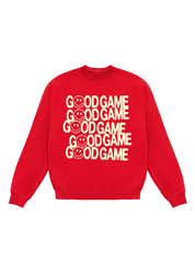 A red crewneck sweatshirt featuring a stacked graphic print of the words 'GOOD GAME' in cream-colored letters, with a smiley face replacing the 'O' in each line, shown against a plain white background.